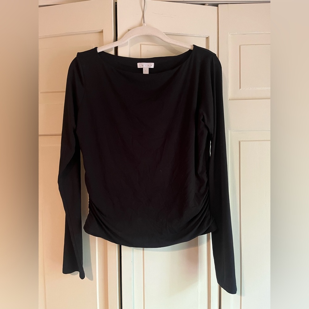 Woman’s large black top